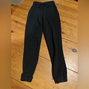 Rue 21 black sweatpants. High waisted, with waist band and string.